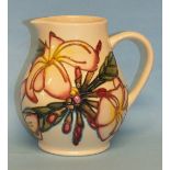 A modern Moorcroft jug decorated with tubeline flowers, 14cm high, impressed factory mark, key