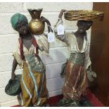 A pair of plaster figures depicting a Moroccan young woman resting a water jug on her shoulder and