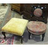 An ebonised late-Victorian nursing chair with padded back and upholstered seat, on turned front legs