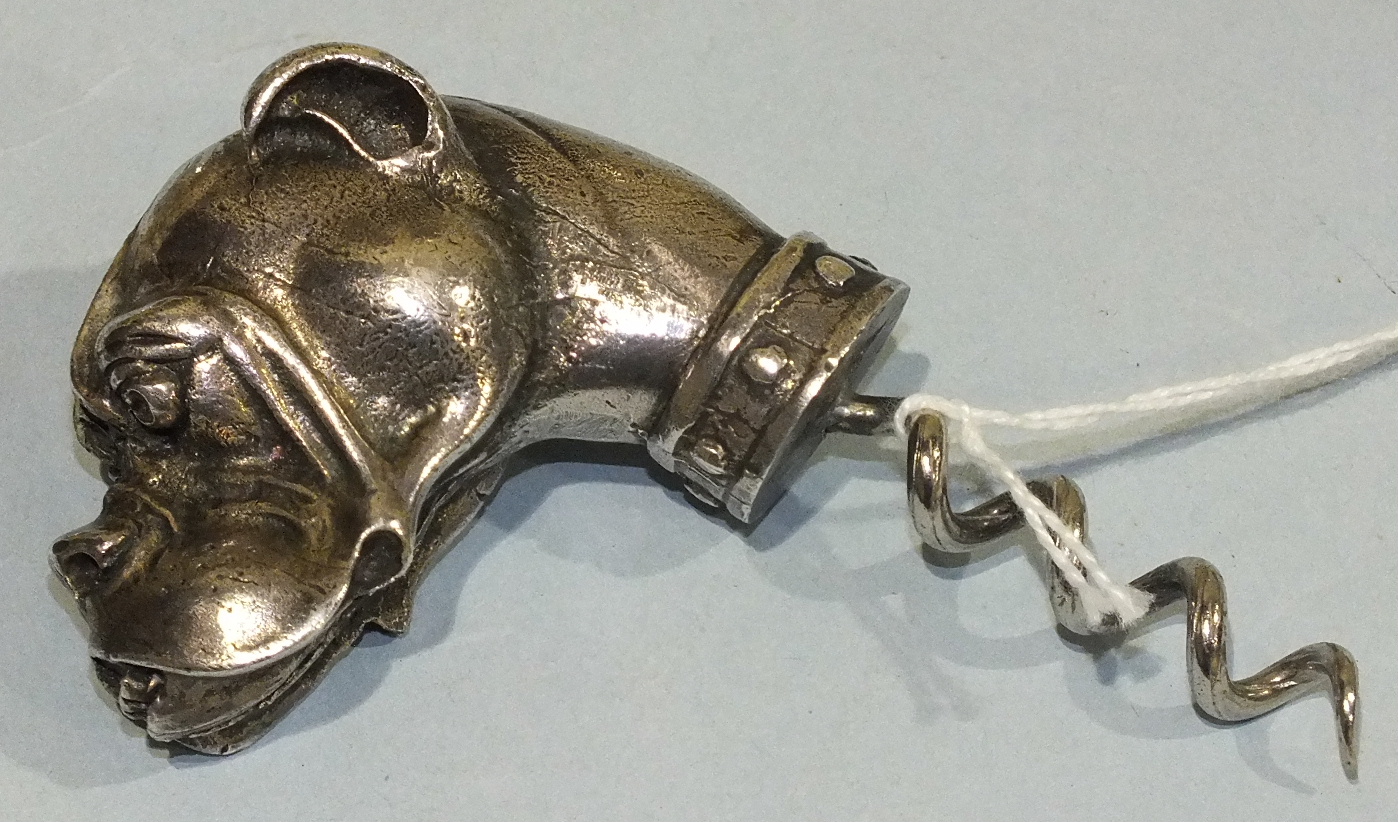 A heavy plated metal corkscrew in the form of a Boxer dog's head, 10cm overall.