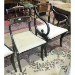 A set of six Georgian-style ebonised wood bar and rope-twist-back dining chairs with drop-in