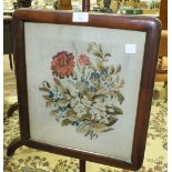A late-19th century mahogany pole screen raised on tripod base, with wool work floral panel, 148cm