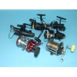 An Abu Garcia Ambassadeur 7000 sea fishing reel in red, a Penn No.160 reel and three spinning reels,