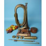 A military brass bugle, a small model of an HMS Ark Royal cannon and other items.