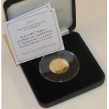 A cased Jubilee Mint 2014 22ct gold proof £1 coin commemorating the 1st Birthday of HRH Prince