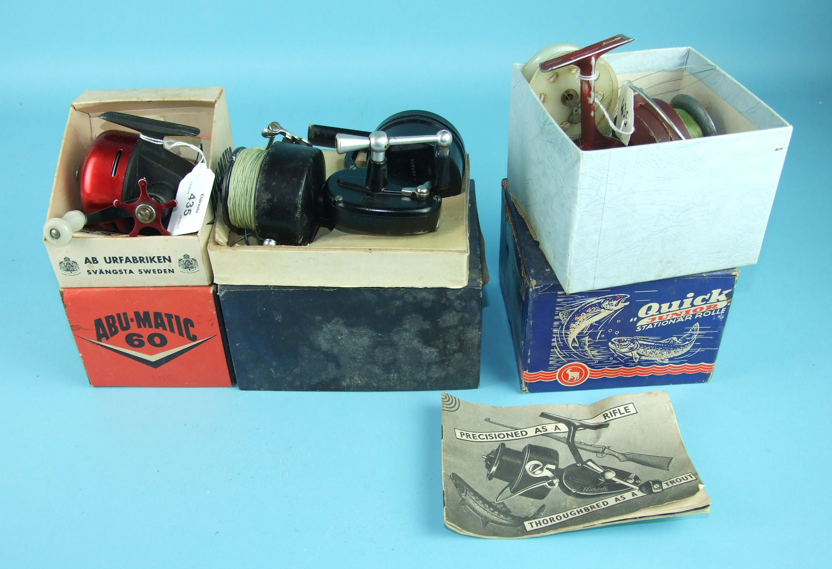 A DAM "Quick Junior" spinning reel finished red, in original box with instructions, an Abumatic 60