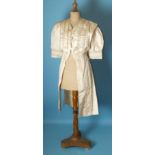 A late-19th century French cream silk coat with puff sleeves, decorated overall with silk braid