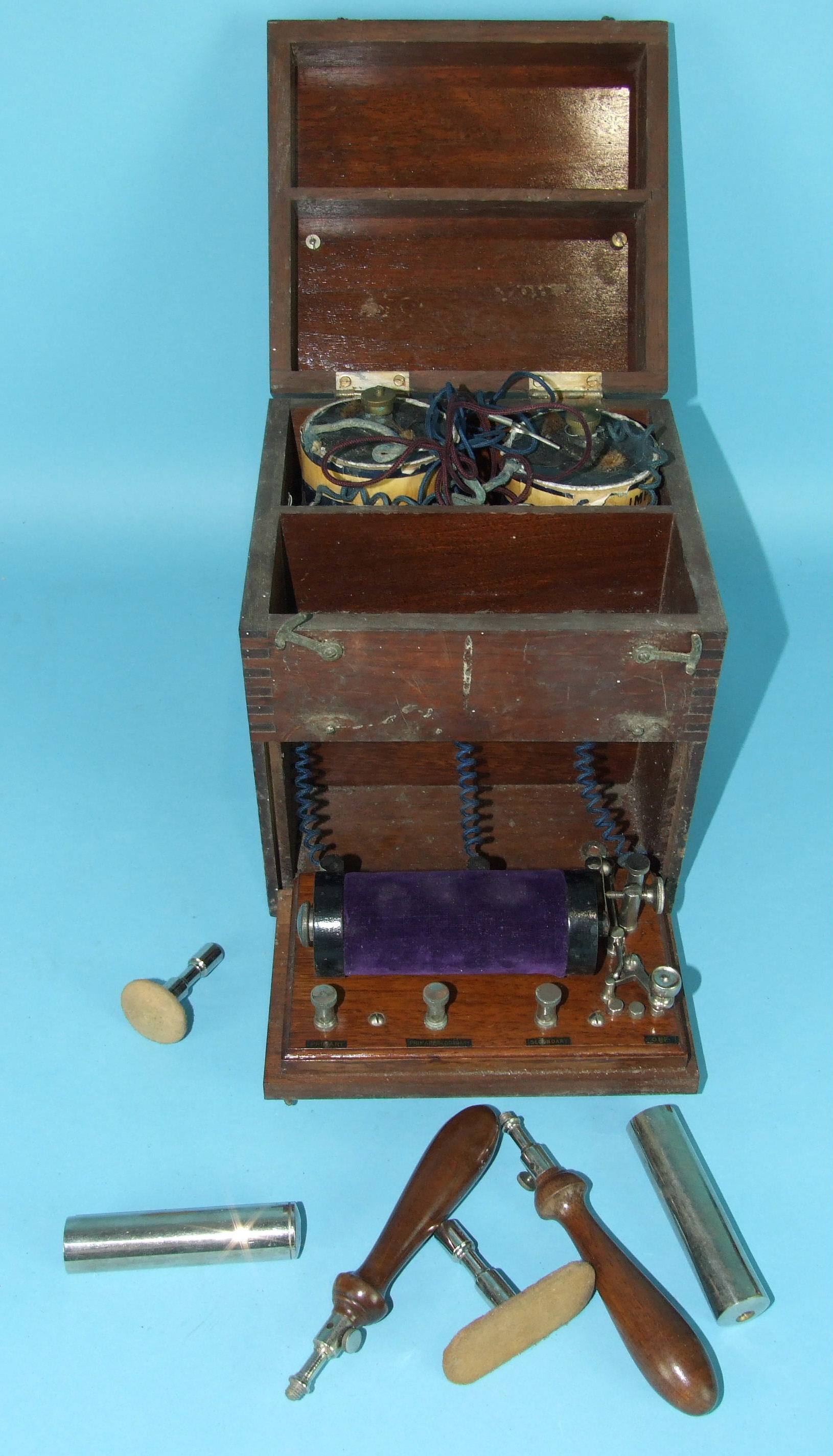 A late-19th/early-20th century mahogany-cased electrical treatment apparatus with brass