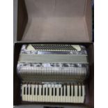 A Bellini piano accordion with grey pearlised body, in case.
