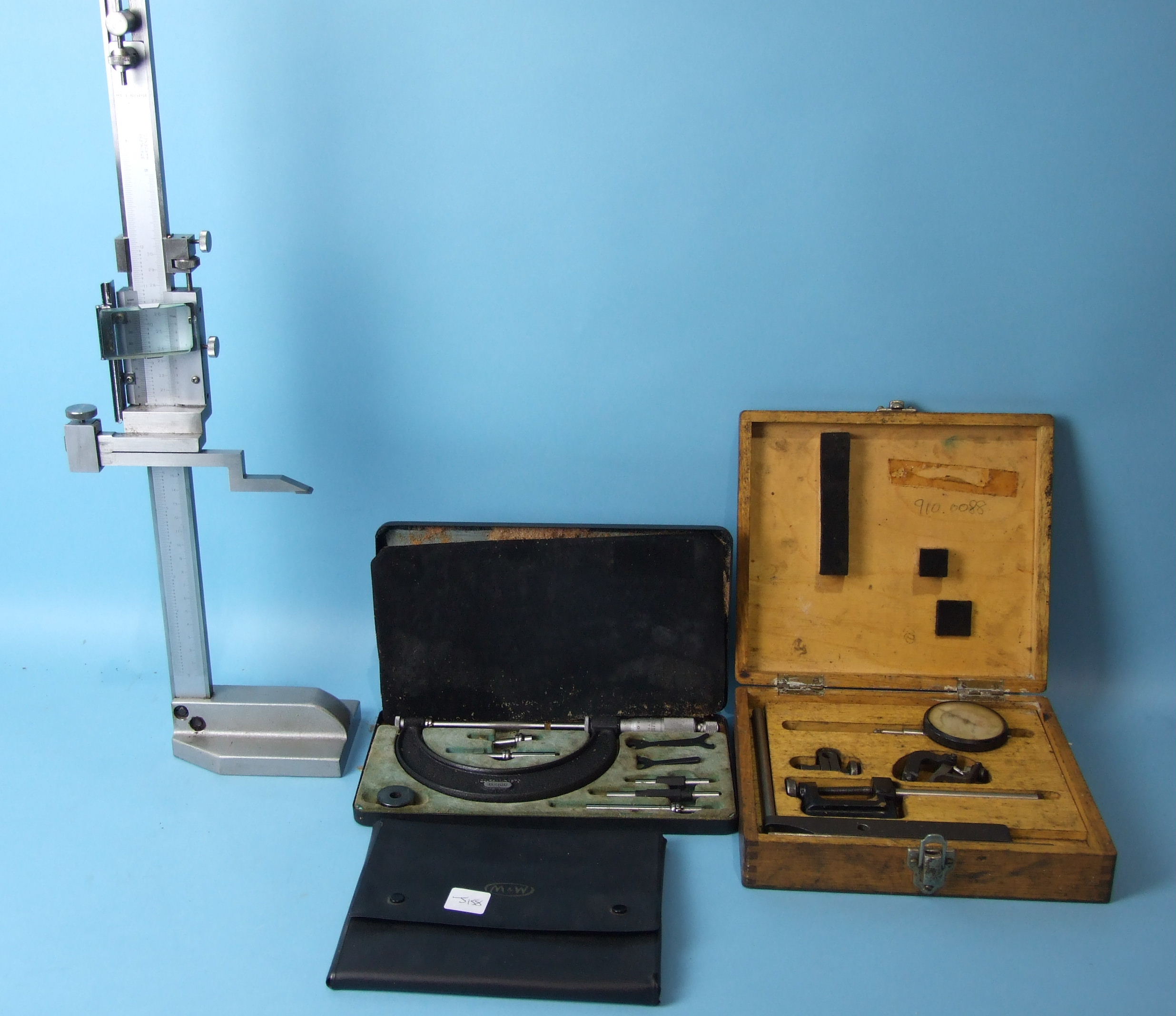 A Chinese-made vertical micrometer, another micrometer, gauges, etc, all boxed.