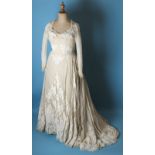 A 20th century wedding dress, with fitted satin and organza strapless under-dress beneath an ivory