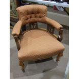 An Edwardian walnut frame tub-style chair with padded button back and arms, with upholstered seat,