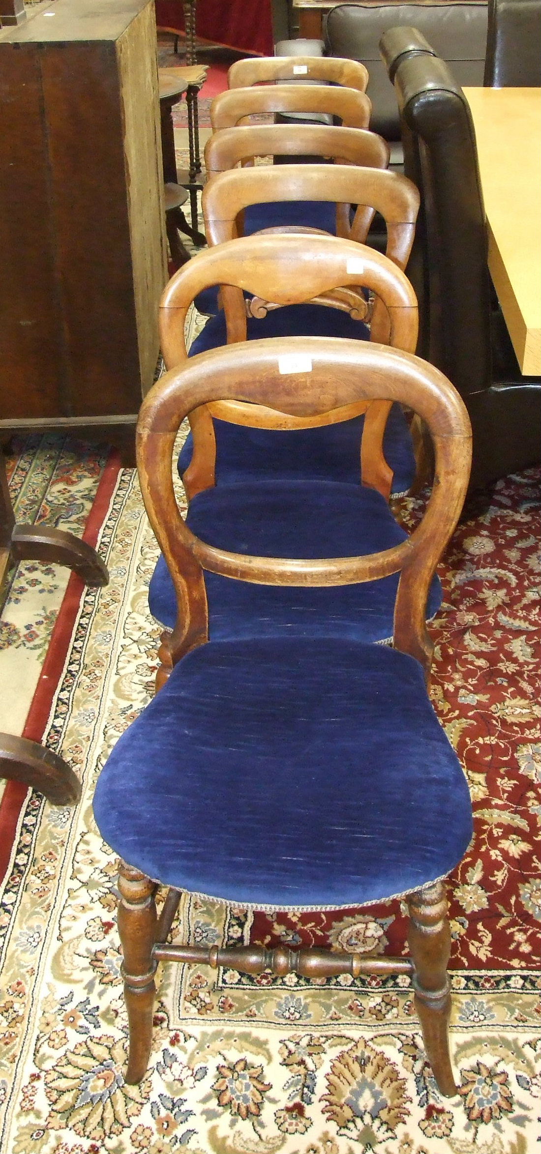 A set of four stained wood dining chairs on turned front legs and a pair of similar chairs, (6).