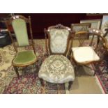 An Edwardian inlaid hall seat, a Victorian walnut nursing chair and two other chairs, (4).