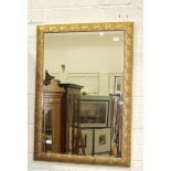 A modern gilt framed bevelled wall mirror, 105 x 73cm.