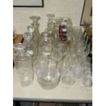 A collection of glassware, including seven decanters, wine and drinking glasses, etc.