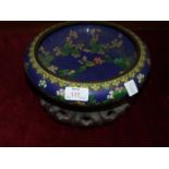 A cloisonné bowl with floral decoration, 25cm diameter, 7cm high on carved hardwood stand.