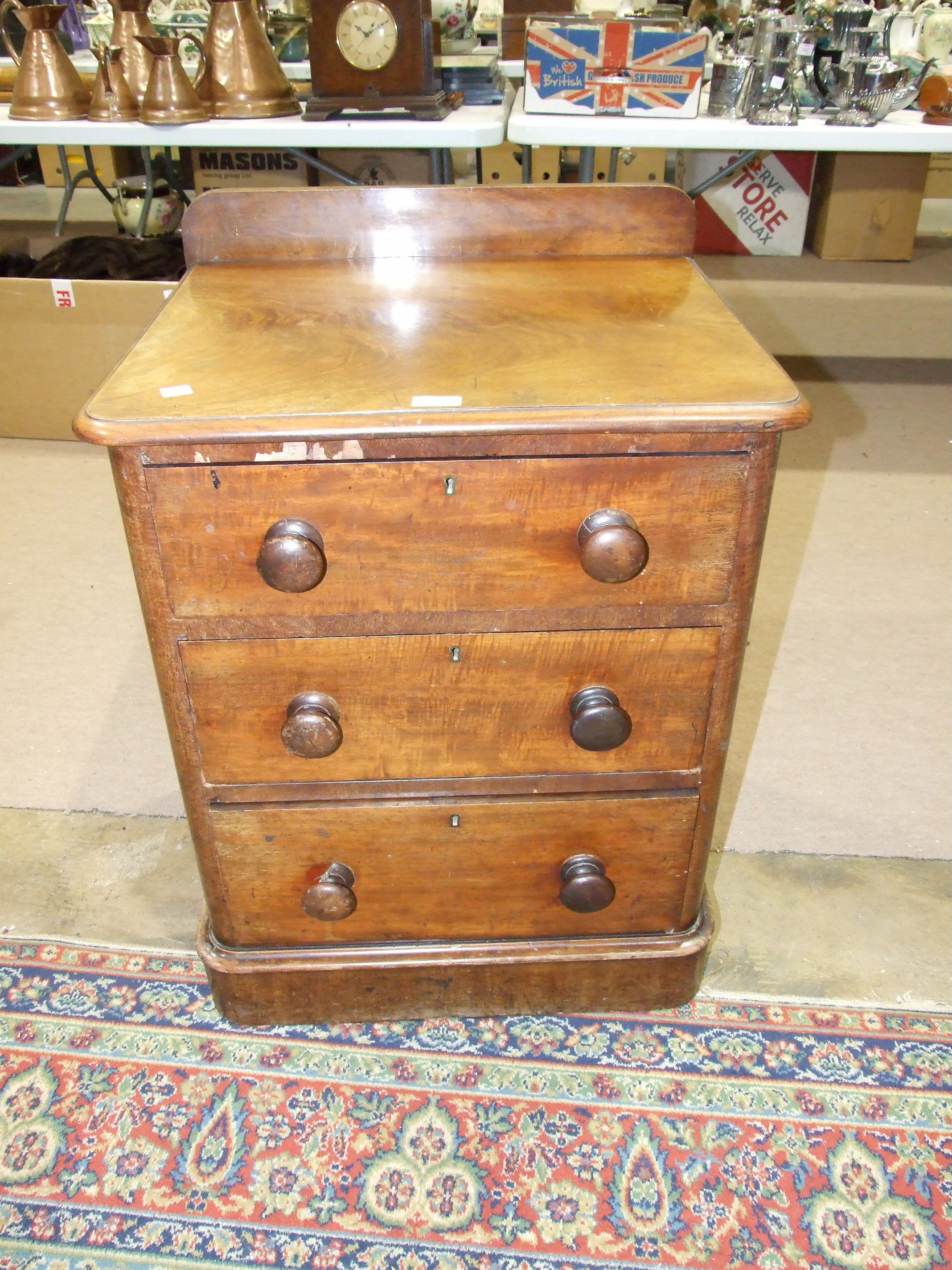 A Victorian three-drawer pedestal of rectangular shape, 60cm wide, 76cm high and an oval wall