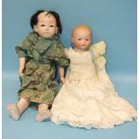 An Armand Marseille Dream Baby, (head cracked) and a Japanese doll with a composite head and lower