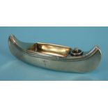 A novelty table lighter/ashtray by Stokes & Ireland Ltd in the form of a canoe, 13cm long, London