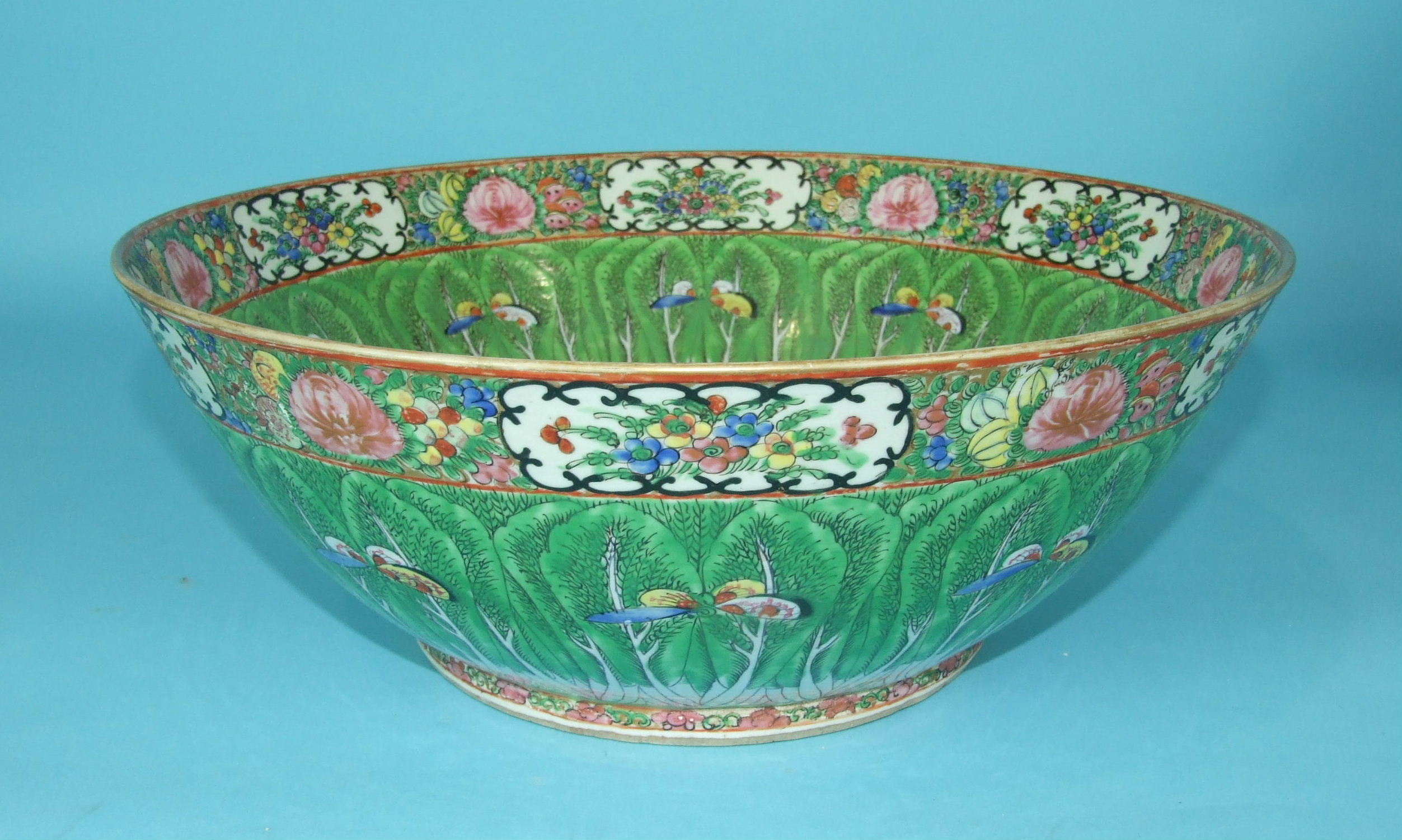 A large early-20th century Chinese Canton-style 'cabbage leaf' punch bowl decorated in coloured