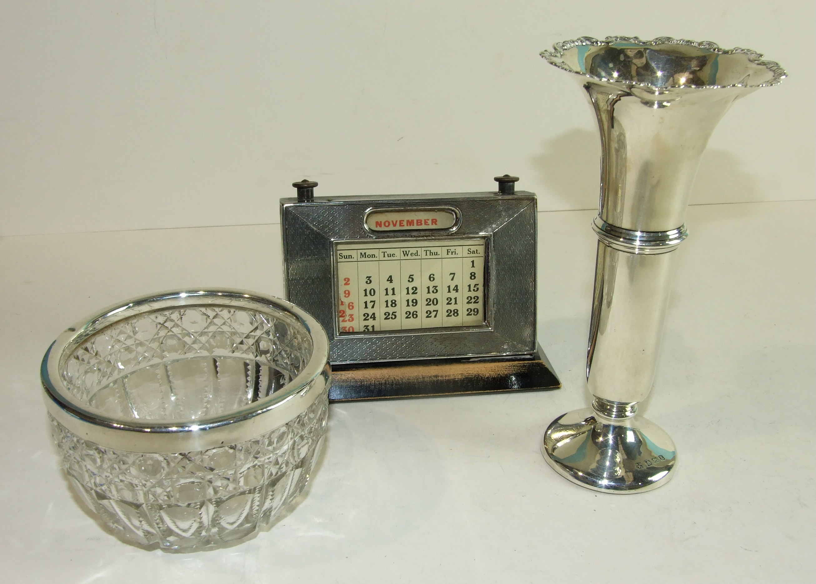 A silver flared spill vase on circular loaded base, 17cm high, (a/f), Birmingham 1929, a wooden