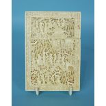 A 19th century Chinese carved ivory card case decorated with numerous figures, buildings and