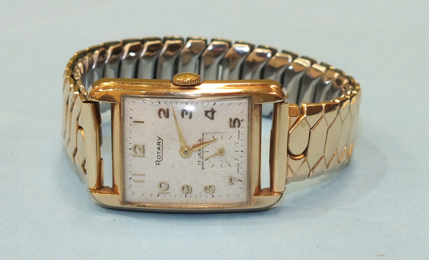 Rotary, a gents 9ct-gold-cased rectangular face wrist watch with Arabic numerals and subsidiary