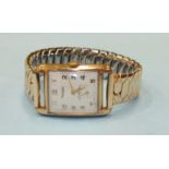 Rotary, a gents 9ct-gold-cased rectangular face wrist watch with Arabic numerals and subsidiary