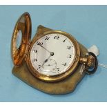 A gold-plated half hunter keyless pocket watch, the outer chapter ring with Roman numerals, the