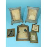 A pair of small metal Art Nouveau-style picture frames, 14 x 10cm and other frames.