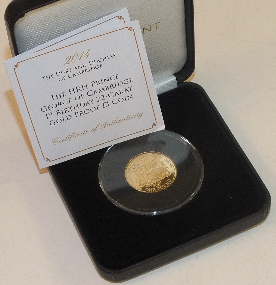 A cased Jubilee Mint 2014 22ct gold proof £1 coin commemorating the 1st Birthday of HRH Prince