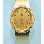 Omega, a ladies 1980's Omega de Ville wrist watch, the oval bezel set fourteen 8/8 cut diamonds