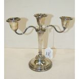 A modern table candelabrum, 21cm high, Birmingham 1960 and a short loaded candlestick, (2).