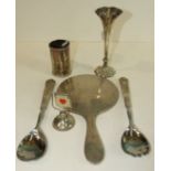 A small cylindrical beaten silver bottle holder, 8.5cm high, London 1910, ___1oz, a loaded silver