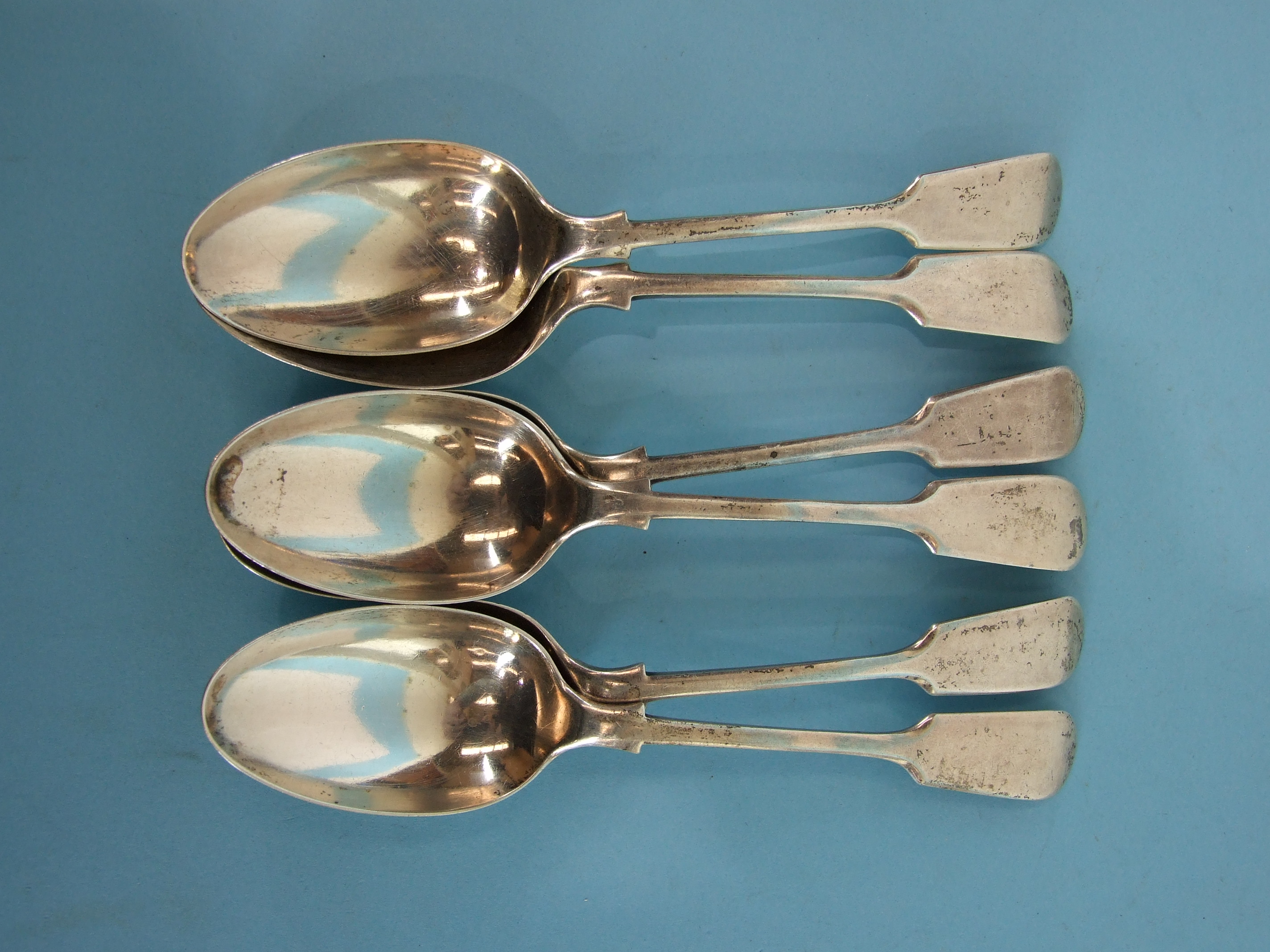 A set of six fiddle pattern silver dessert spoons, London 1911, ___9oz.