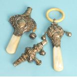 A mother-of-pearl-handled baby rattle, Birmingham 1907, another and a combination rattle/whistle,