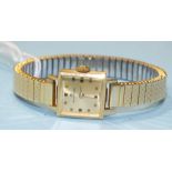 Bucherer, a ladies 18ct gold square-cased wrist watch, the gilt dial with square numerals, 15mm