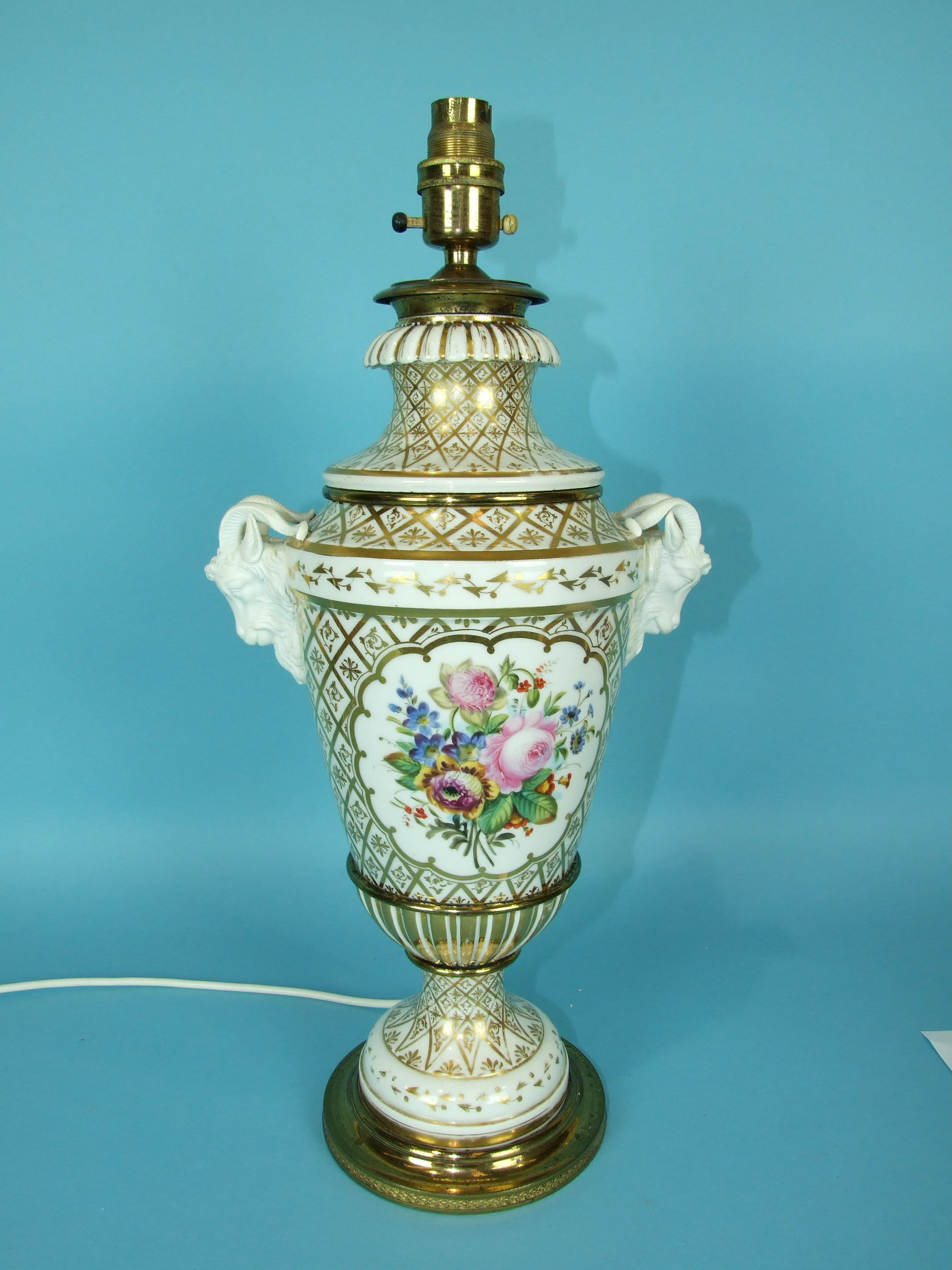 A large 19th century French porcelain vase decorated with panels of flowers on a white and gilt - Image 2 of 4