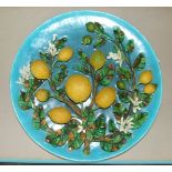 A large 19th century French majolica trompe l'oeil dish covered with fruiting lemon branches,