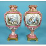 A pair of 19th century ormolu-mounted Sèvres-style vases decorated with panels of flowers and scenes