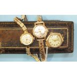 Baume, a ladies 9ct-gold-cased wrist watch on plated bracelet, boxed, and two other ladies wrist