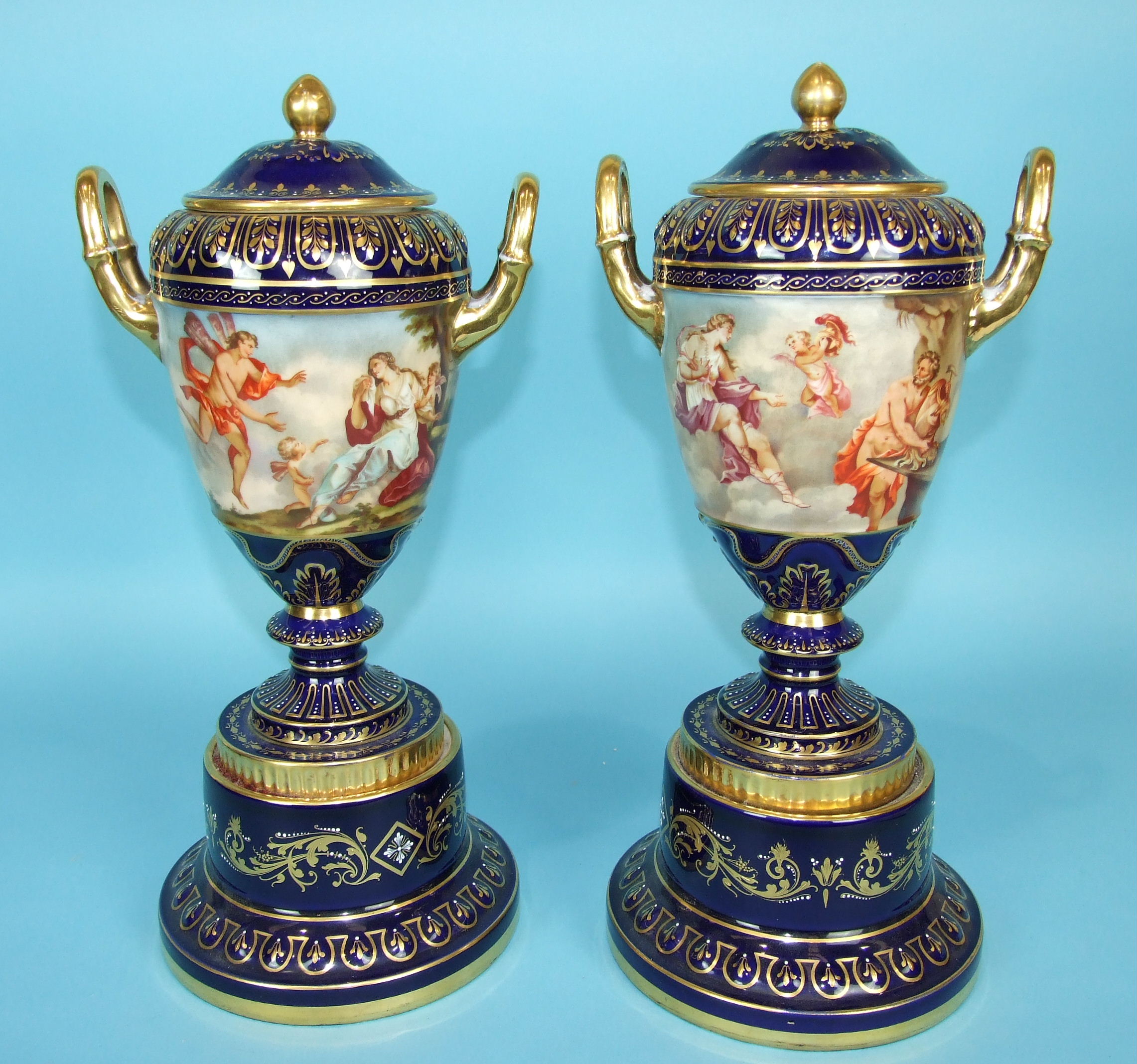 A pair of large 19th century Vienna porcelain vases and covers decorated with classical scenes and