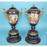 A pair of large 19th century Vienna porcelain vases and covers decorated with classical scenes and