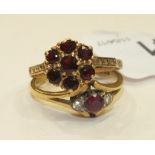 A ruby and diamond ring, size N, and a garnet cluster ring, size O, both 9ct gold, 4.9g.