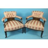 A pair of Edwardian low tub armchairs, each frame with ivory and boxwood inlay depicting cherubs,