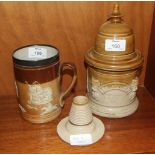 A Royal Doulton salt glaze tankard with silver-mounted rim, 14cm high, a stoneware tobacco jar and
