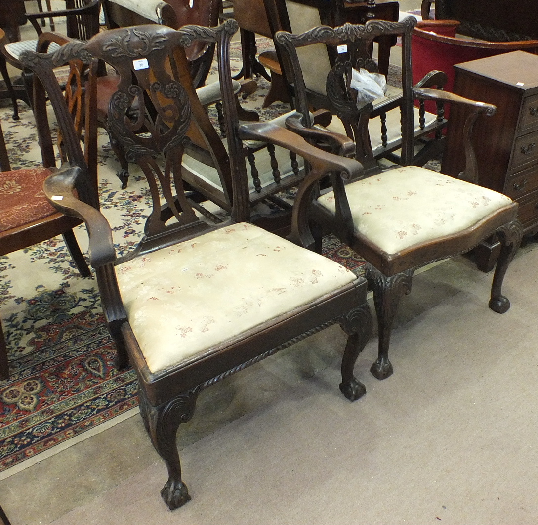 An 18th century mahogany Chippendale-style elbow chair of generous proportions, with foliate pierced