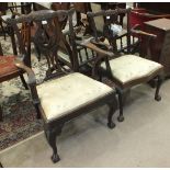 An 18th century mahogany Chippendale-style elbow chair of generous proportions, with foliate pierced