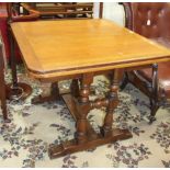 An oak draw leaf dining table on turned end-supports united by a stretcher, 150 x 1=90cm open, and